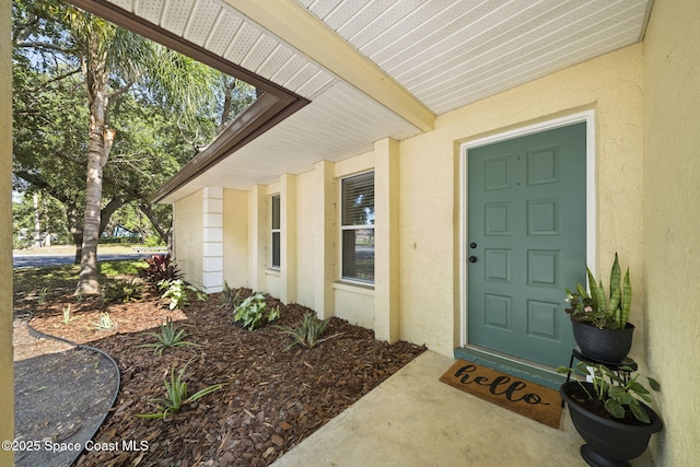 2036 Hogan Dr, Melbourne, FL 32935 - doorway to property with stucco siding