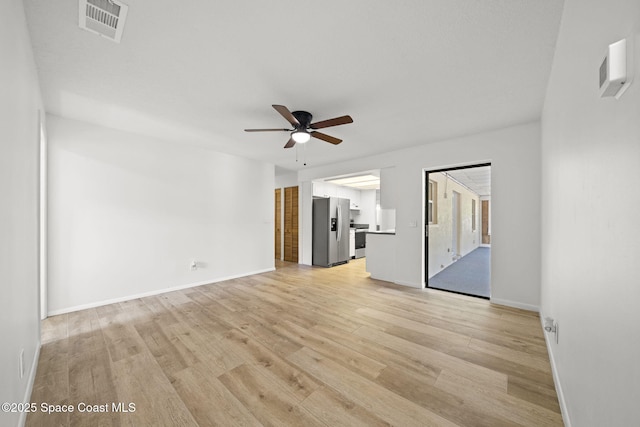 2036 Hogan Dr, Melbourne, FL 32935 - unfurnished room featuring ceiling fan, light wood-style floors, and baseboards