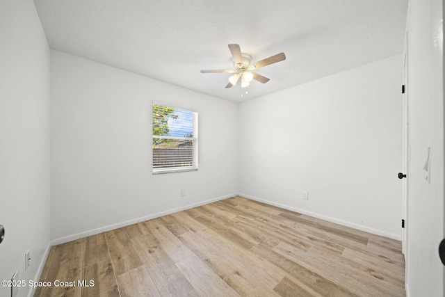 2036 Hogan Dr, Melbourne, FL 32935 - spare room with a ceiling fan, light wood finished floors, and baseboards