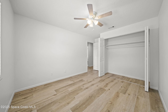 2036 Hogan Dr, Melbourne, FL 32935 - unfurnished bedroom with wood finished floors, a closet, baseboards, and a ceiling fan