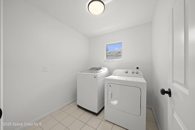2036 Hogan Dr, Melbourne, FL 32935 - washroom with washing machine and clothes dryer and baseboards