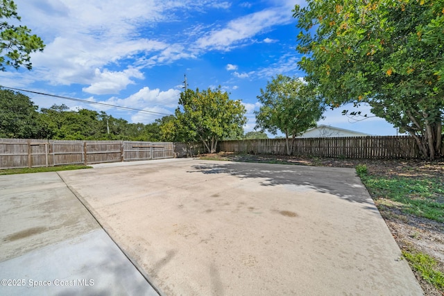 2036 Hogan Dr, Melbourne, FL 32935 - fenced backyard with a patio area
