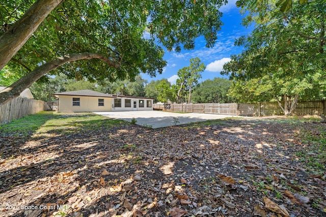 2036 Hogan Dr, Melbourne, FL 32935 - fenced backyard with a patio