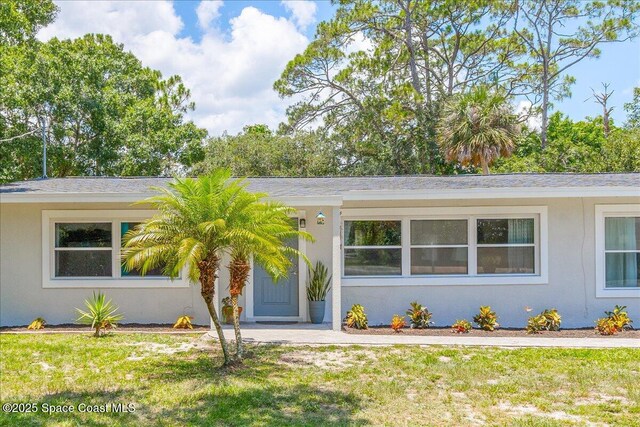 439 Blue Heron Rd, Melbourne Village, FL 32904 - ranch-style home featuring stucco siding and a front yard