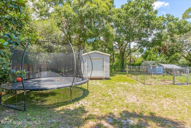 439 Blue Heron Rd, Melbourne Village, FL 32904 - view of yard with a trampoline, a storage unit, and a garden