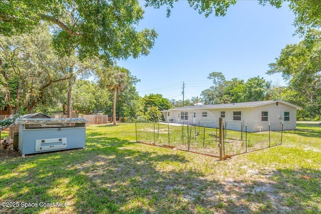 439 Blue Heron Rd, Melbourne Village, FL 32904 - view of yard with a vegetable garden and view of scattered trees