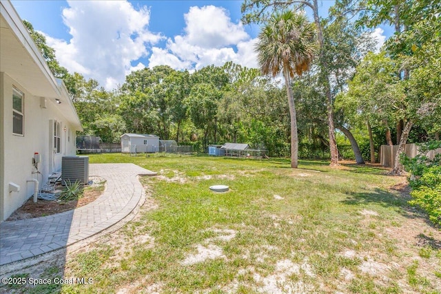 439 Blue Heron Rd, Melbourne Village, FL 32904 - fenced backyard with view of scattered trees and a shed
