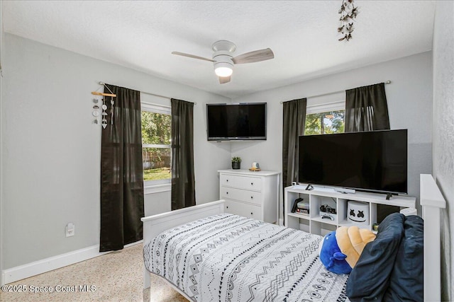 439 Blue Heron Rd, Melbourne Village, FL 32904 - bedroom with speckled floor and ceiling fan