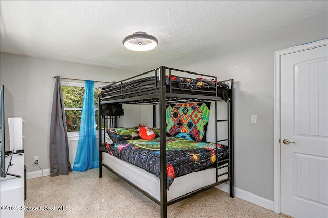 439 Blue Heron Rd, Melbourne Village, FL 32904 - bedroom featuring speckle patterned floor and a textured ceiling