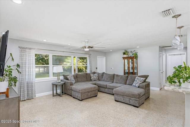 439 Blue Heron Rd, Melbourne Village, FL 32904 - living room featuring speckle patterned floor, recessed lighting, and ceiling fan