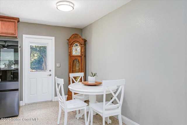 439 Blue Heron Rd, Melbourne Village, FL 32904 - dining space with dark speckled floor and baseboards