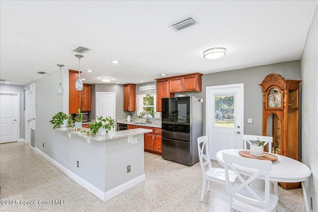 439 Blue Heron Rd, Melbourne Village, FL 32904 - kitchen with smart refrigerator, a peninsula, dark aggregate flooring, decorative light fixtures, and recessed lighting