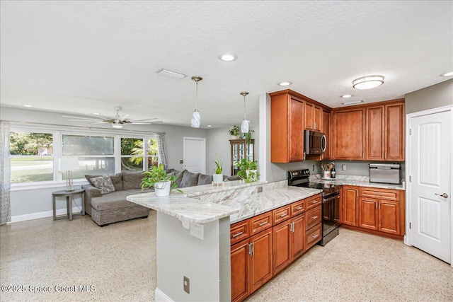 439 Blue Heron Rd, Melbourne Village, FL 32904 - kitchen featuring black electric range, stainless steel microwave, a peninsula, recessed lighting, and brown cabinetry