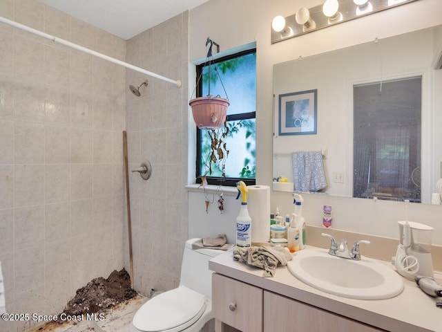 3625 2nd Ln, Vero Beach, FL 32968 - full bathroom featuring vanity, tiled shower, and toilet