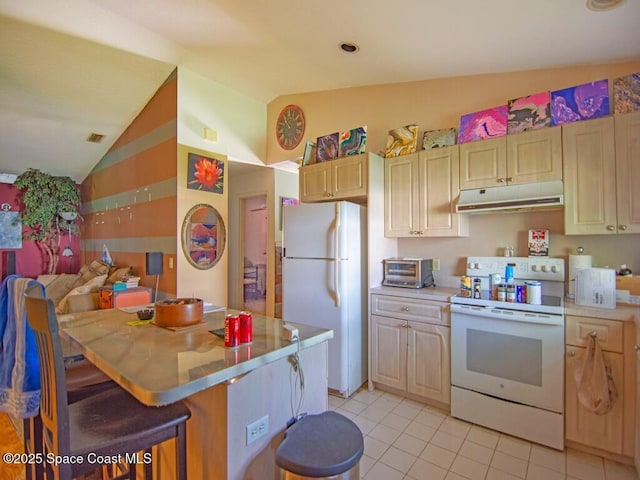 3625 2nd Ln, Vero Beach, FL 32968 - kitchen with white appliances, under cabinet range hood, lofted ceiling, light tile patterned floors, and light countertops