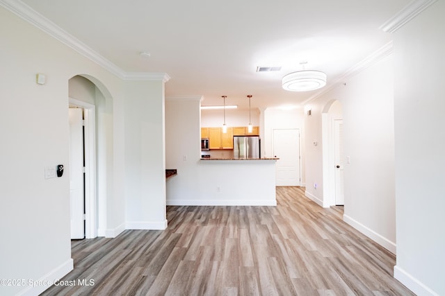 6421 Borasco Dr Unit 3208, Melbourne, FL 32940 - unfurnished living room featuring arched walkways, light wood-type flooring, ornamental molding, and baseboards