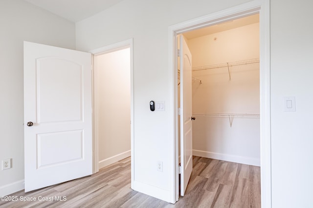 6421 Borasco Dr Unit 3208, Melbourne, FL 32940 - unfurnished bedroom featuring wood finished floors, a closet, baseboards, and a spacious closet