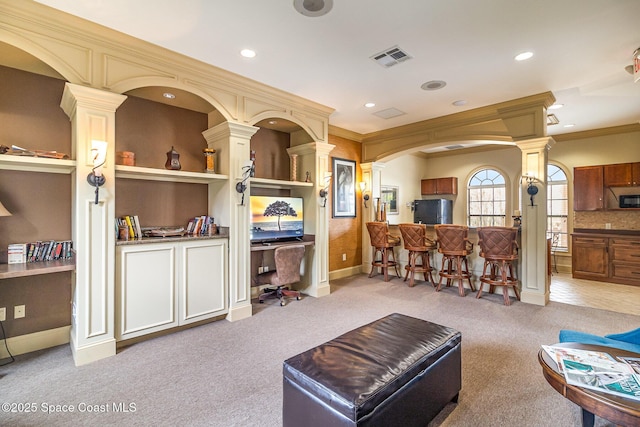 6421 Borasco Dr Unit 3208, Melbourne, FL 32940 - living area featuring decorative columns, carpet flooring, recessed lighting, arched walkways, and ornamental molding