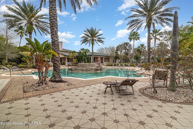6421 Borasco Dr Unit 3208, Melbourne, FL 32940 - community pool featuring a patio area and a hot tub