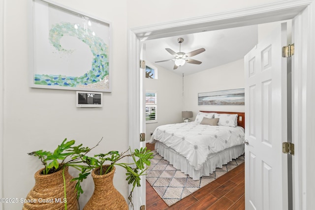 7701 Candlewick Dr, Melbourne, FL 32940 - bedroom featuring wood finished floors, a ceiling fan, baseboards, and lofted ceiling