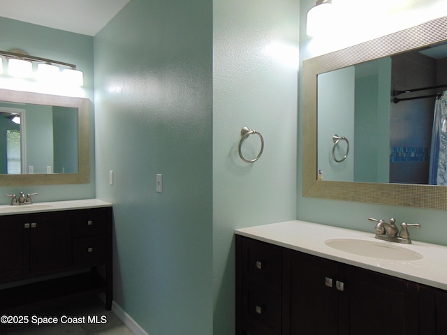 636 Fishtail Palm Blvd, Melbourne, FL 32901 - full bath with two vanities and baseboards