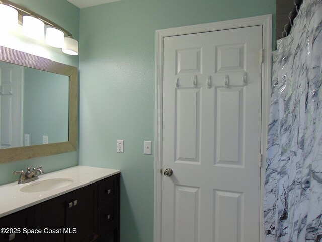 636 Fishtail Palm Blvd, Melbourne, FL 32901 - full bath featuring vanity and a shower with curtain