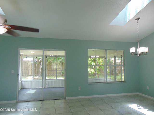636 Fishtail Palm Blvd, Melbourne, FL 32901 - empty room with a skylight, ceiling fan, healthy amount of natural light, a chandelier, and lofted ceiling