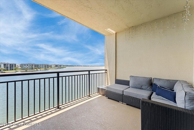 4125 W End Rd Unit 405, Cocoa Beach, FL 32931 - balcony featuring an outdoor hangout area and a water view