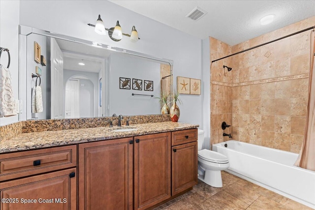 4125 W End Rd Unit 405, Cocoa Beach, FL 32931 - bathroom with vanity, shower / bathtub combination with curtain, and toilet