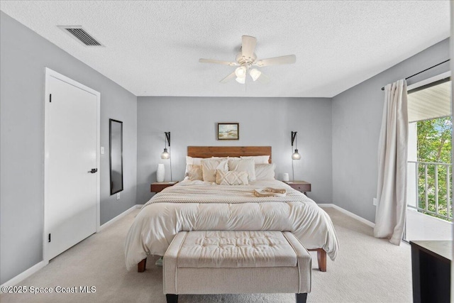 149 Kristi Dr, Indian Harbour Beach, FL 32937 - bedroom featuring light carpet, baseboards, a textured ceiling, and ceiling fan