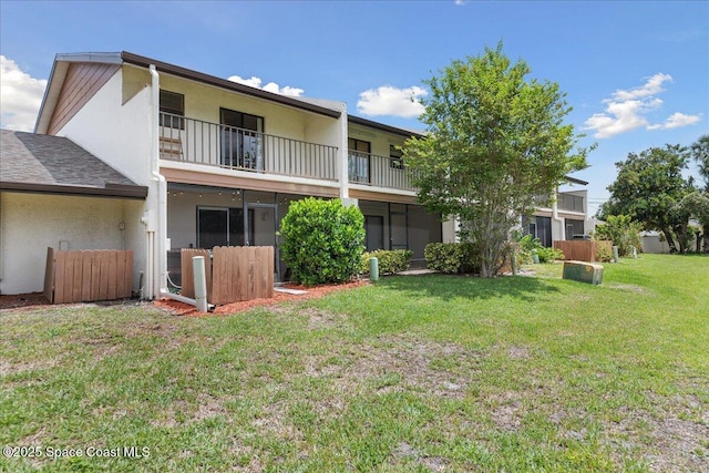 149 Kristi Dr, Indian Harbour Beach, FL 32937 - rear view of house featuring a balcony and stucco siding