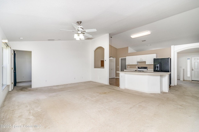 3220 Lowry Blvd SE, Palm Bay, FL 32909 - unfurnished living room with lofted ceiling, a sink, light carpet, and ceiling fan