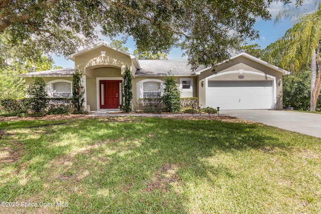 3220 Lowry Blvd SE, Palm Bay, FL 32909 - view of front of home featuring stucco siding, concrete driveway, a front lawn, and an attached garage