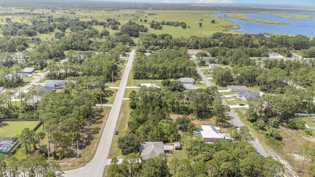 3220 Lowry Blvd SE, Palm Bay, FL 32909 - aerial overview of property's location with a large body of water and nearby suburban area