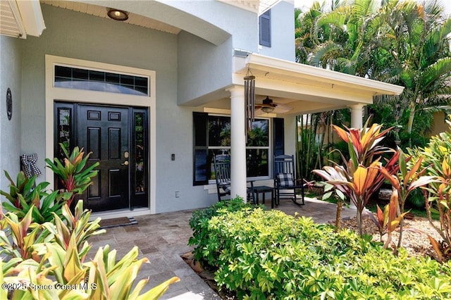 121 Amherst Ln, Sebastian, FL 32958 - property entrance with stucco siding and a ceiling fan