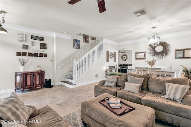 121 Amherst Ln, Sebastian, FL 32958 - living area with stairs, ceiling fan, arched walkways, baseboards, and ornamental molding