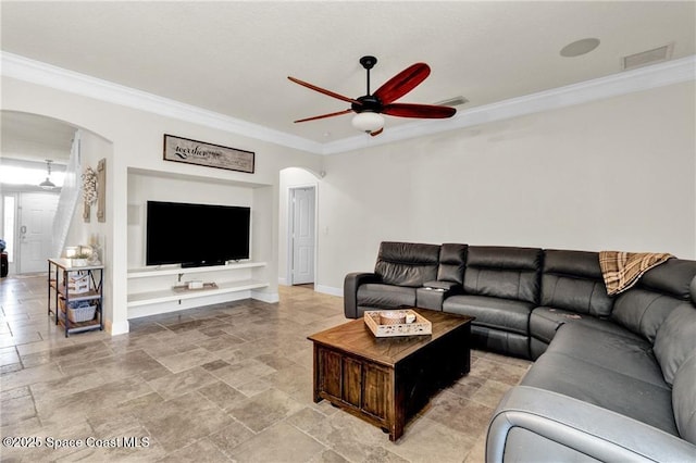 121 Amherst Ln, Sebastian, FL 32958 - living area featuring arched walkways, a ceiling fan, ornamental molding, light stone finish flooring, and baseboards