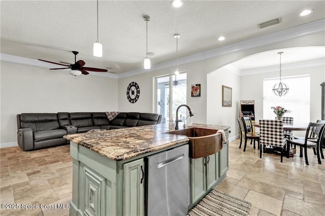 121 Amherst Ln, Sebastian, FL 32958 - kitchen with stainless steel dishwasher, a sink, baseboards, ceiling fan, and stone tile flooring