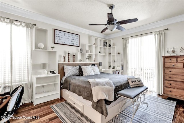 121 Amherst Ln, Sebastian, FL 32958 - bedroom with ornamental molding, wood finished floors, a textured ceiling, and ceiling fan