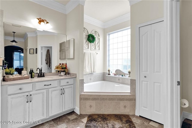 121 Amherst Ln, Sebastian, FL 32958 - bathroom with a closet, vanity, a garden tub, and ornamental molding