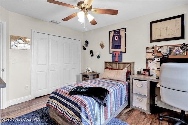121 Amherst Ln, Sebastian, FL 32958 - bedroom with wood finished floors, a closet, ceiling fan, and baseboards