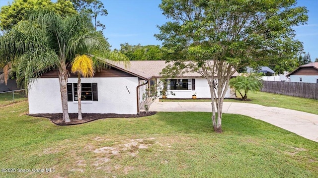 7020 Kaylor Ave, Cocoa, FL 32927 - ranch-style home with stucco siding and curved driveway