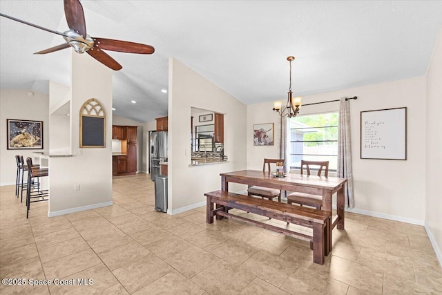 7020 Kaylor Ave, Cocoa, FL 32927 - dining space with lofted ceiling, a chandelier, ceiling fan, and light tile patterned floors