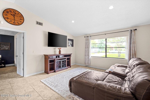 7020 Kaylor Ave, Cocoa, FL 32927 - living area with lofted ceiling, recessed lighting, and light tile patterned floors
