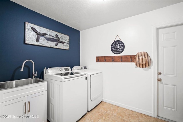 7020 Kaylor Ave, Cocoa, FL 32927 - laundry area with separate washer and dryer, cabinet space, light tile patterned flooring, and a textured ceiling