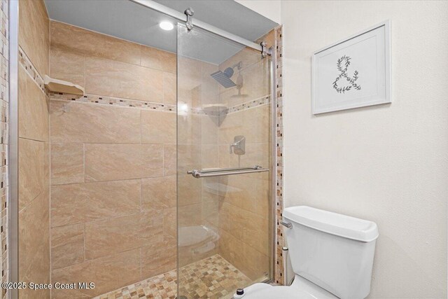 7020 Kaylor Ave, Cocoa, FL 32927 - bathroom featuring a shower stall and toilet