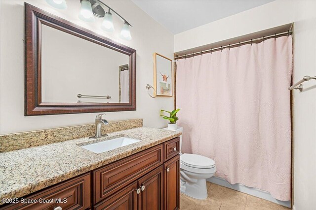 7020 Kaylor Ave, Cocoa, FL 32927 - bathroom featuring vanity, tile patterned flooring, and a shower with curtain