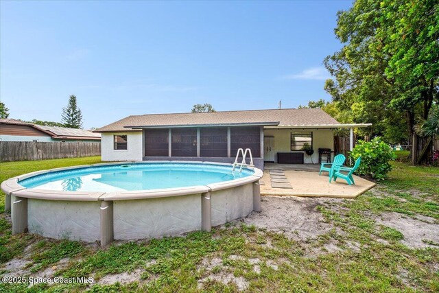 7020 Kaylor Ave, Cocoa, FL 32927 - outdoor pool featuring a sunroom and a patio area