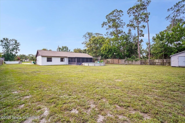 7020 Kaylor Ave, Cocoa, FL 32927 - fenced backyard featuring a sunroom and a storage shed
