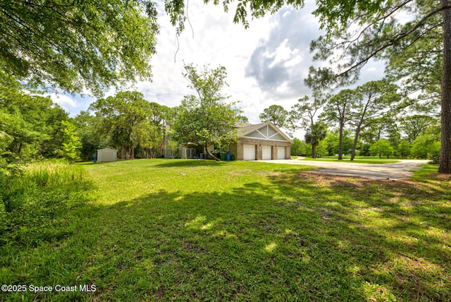 4956 Corfu Dr, Cocoa, FL 32926 - view of green lawn featuring driveway